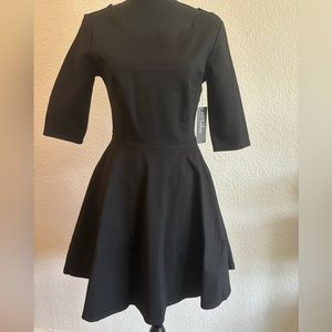 Black Lulu’s skater style dress, scalloped neckline